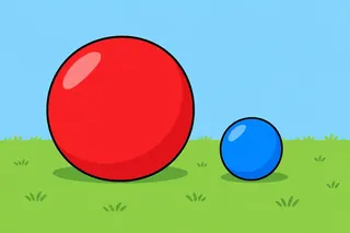 A big red ball and a small blue ball on green grass under a blue sky.